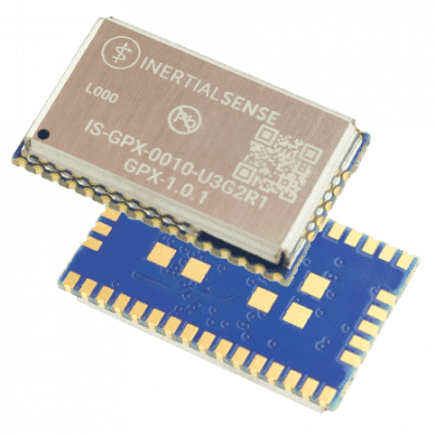 Two small rectangular electronic chips, one with a metallic top labeled "INERTIAL SENSE," stacked on a blue chip with gold contact pads.