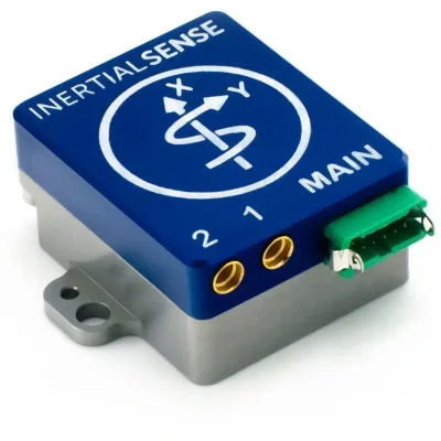 A blue and silver InertialSense electronic sensor module with labeled ports and a green connector.
